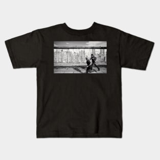 Two kids running along the remains of the Berlin Wall, Berlin, Germany Kids T-Shirt